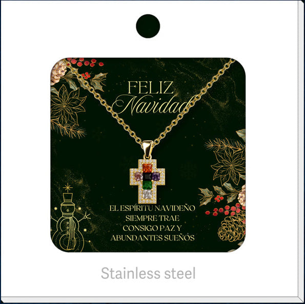 Collar dorado de cruz multicolor, presentado en tarjeta navideña.