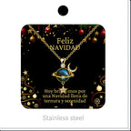 Collar de planeta azul con luna y estrella, presentado en tarjeta navideña.