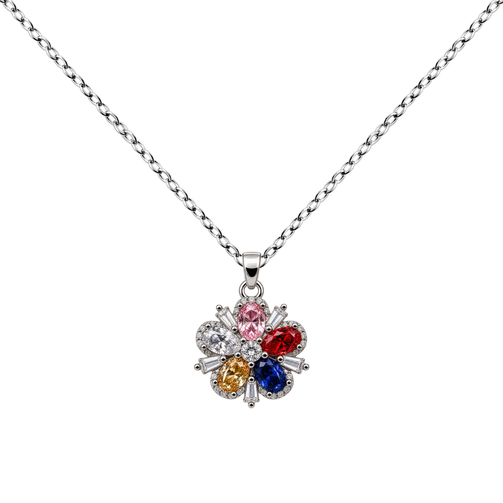 Collar de flor multicolor con circonitas, con pétalos de distintos colores, sobre fondo blanco.