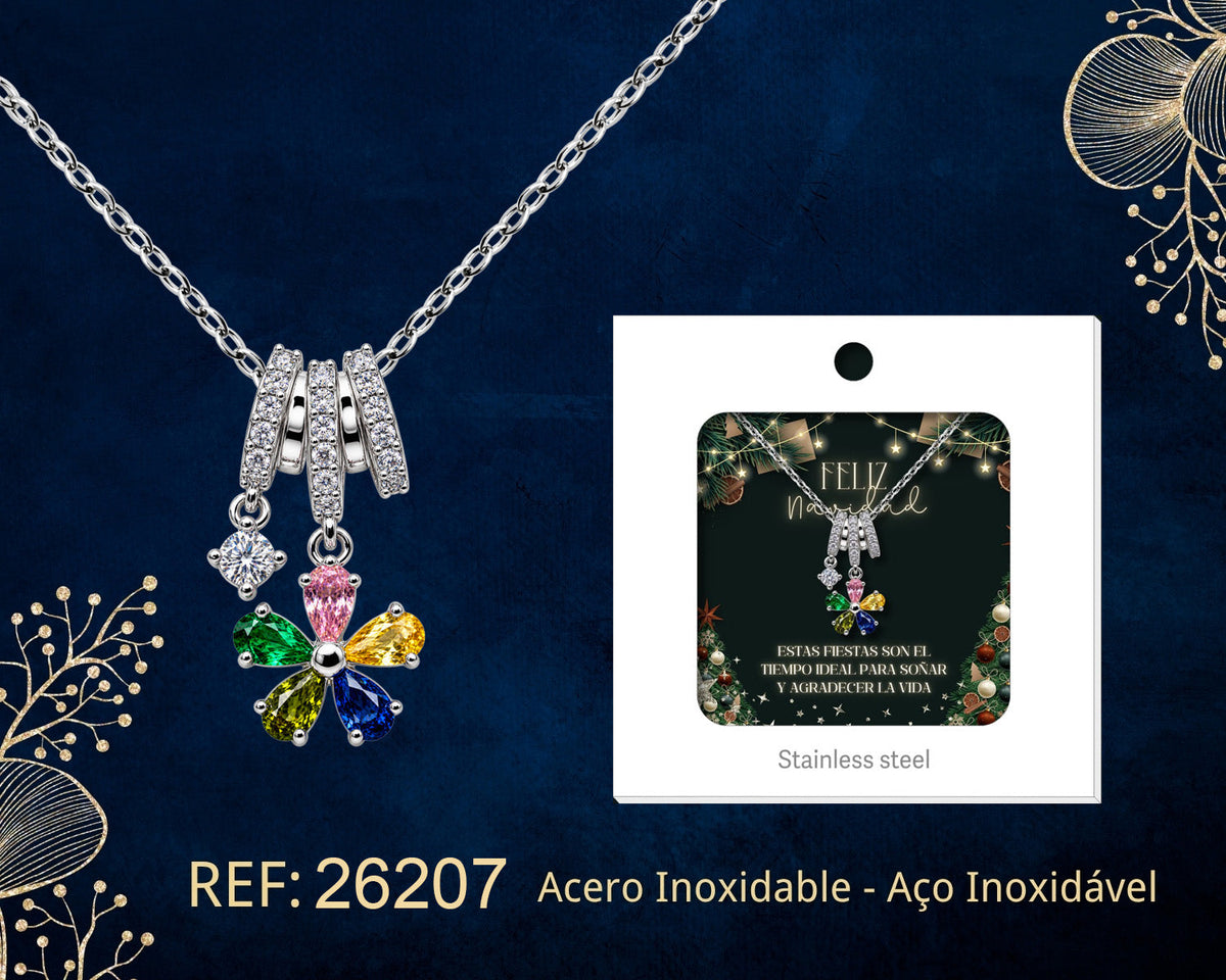 Collar de flor con circonitas de colores junto a su tarjeta de regalo, sobre fondo oscuro.