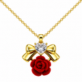 Red Rose and Gold Tone Bow Necklace, with a light-coloured heart-shaped detail, on a white background.