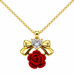 Red Rose and Gold Tone Bow Necklace, with a light-coloured heart-shaped detail, on a white background.