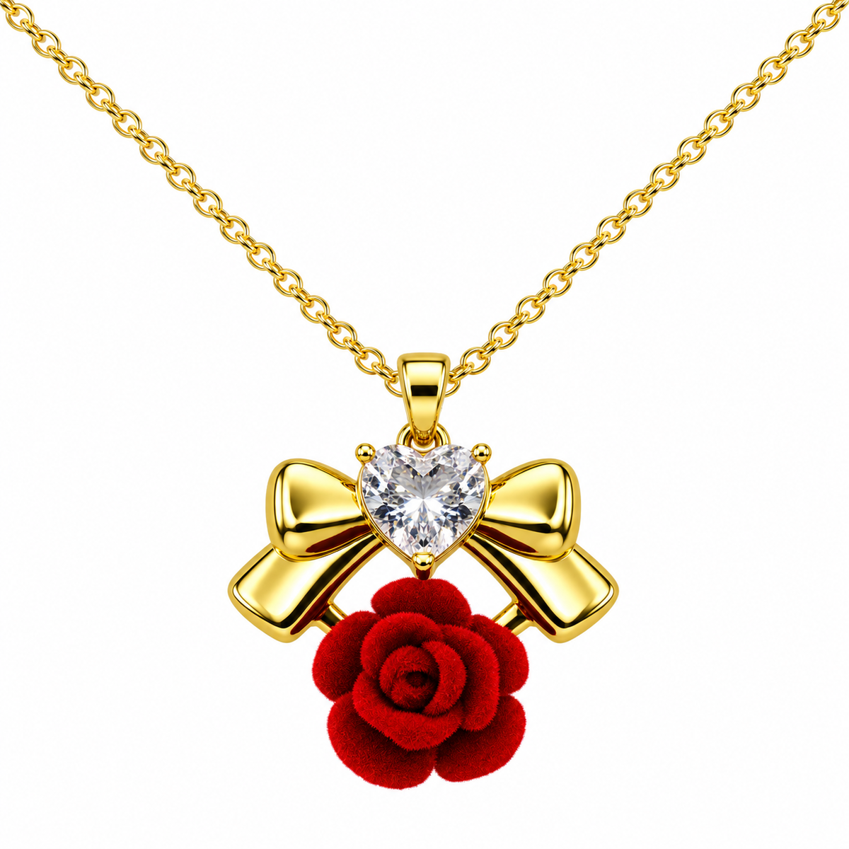 Red Rose and Gold Tone Bow Necklace, with a light-coloured heart-shaped detail, on a white background.