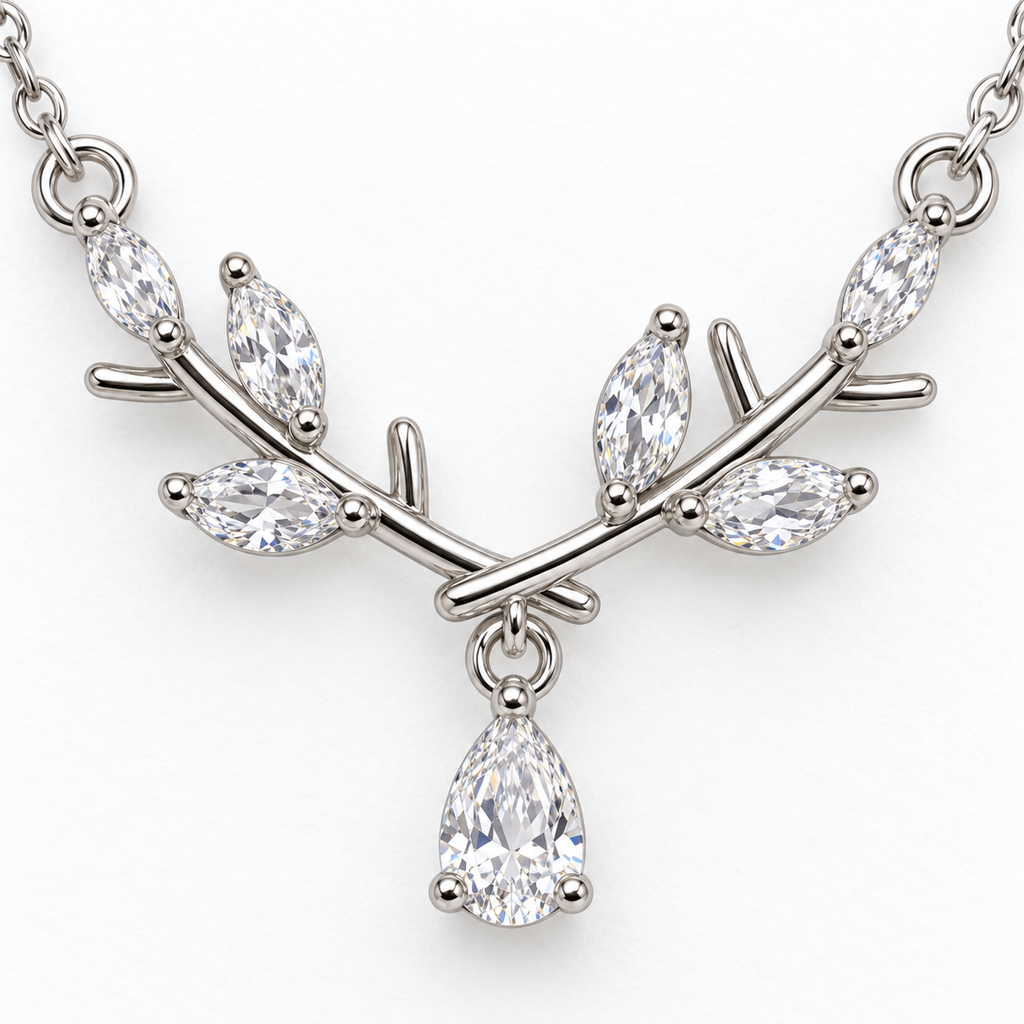 Pendant detail: silver tone branch necklace with teardrop detail.
