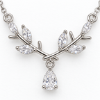 Pendant detail: silver tone branch necklace with teardrop detail.