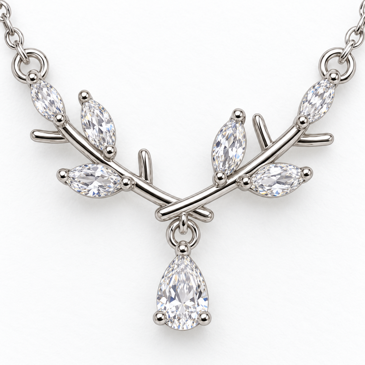 Pendant detail: silver tone branch necklace with teardrop detail.