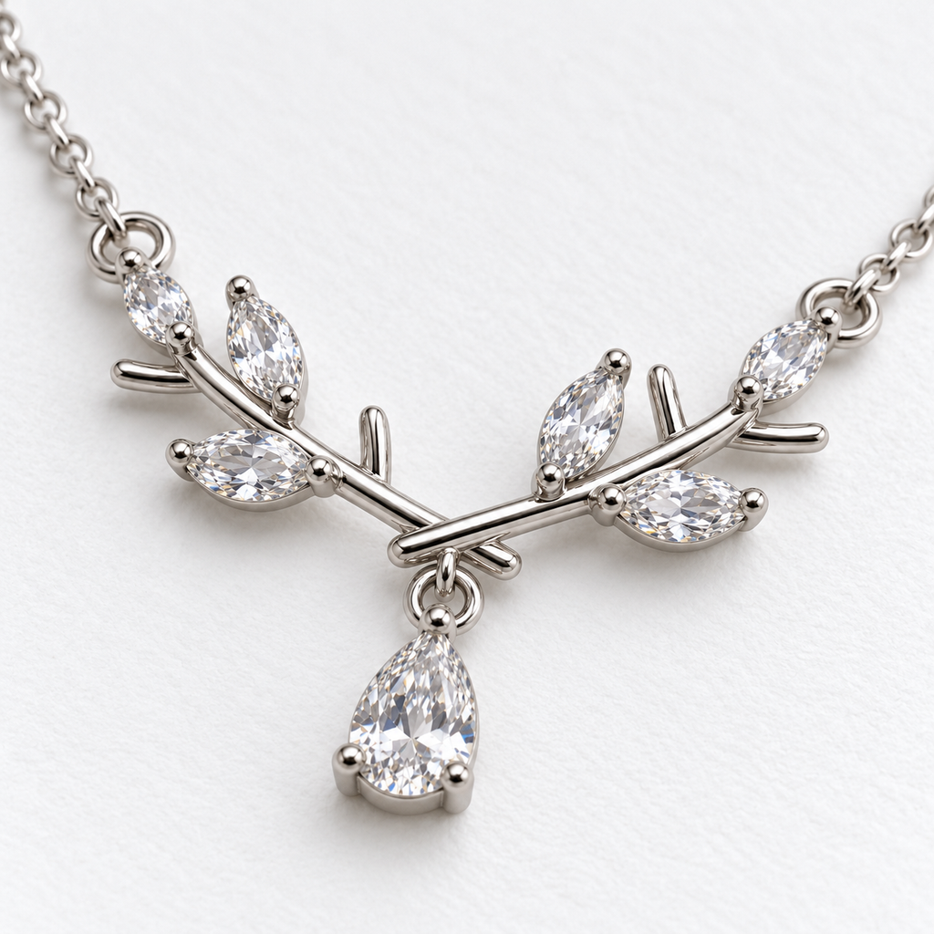 Silver Tone Branch Necklace with Teardrop Detail, viewed at an angle on a white background.
