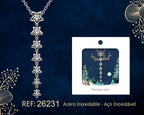Hanging Star Necklace beside its gift message card, on a dark background.