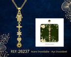 Gold Tone Hand of Fatima Necklace with Hanging Motifs beside its gift message card, on a dark background.