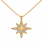 Colar de estrela dourada de oito pontas, com contorno estrelado brilhante, sobre fundo branco.