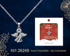 Angel Necklace with Cubic Zirconia beside its gift message card, on a dark background.