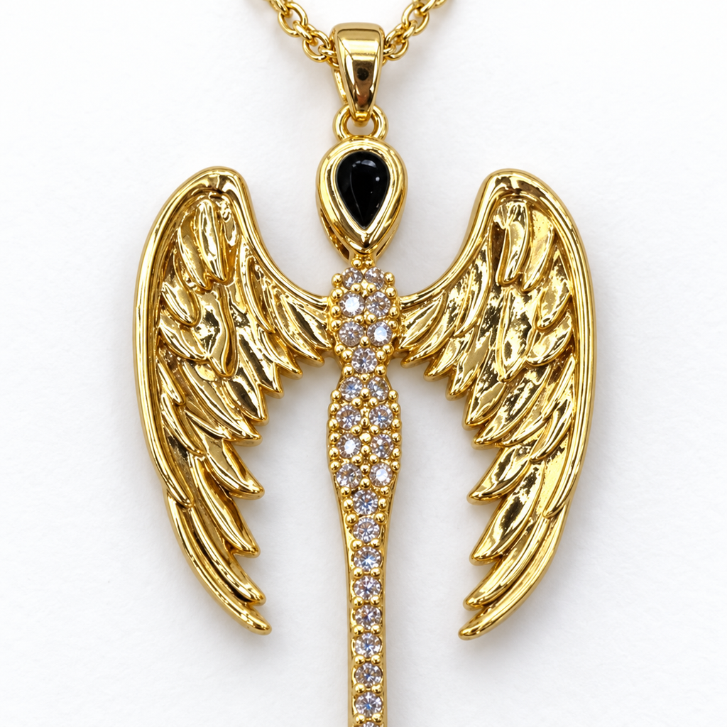 Pendant detail: gold tone wing necklace with cubic zirconia.