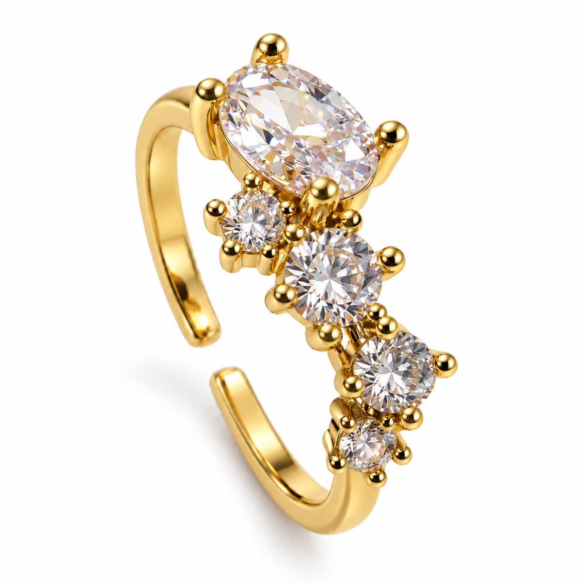 Anillo dorado de centro oval y detalles redondos