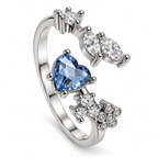 Anillo plateado de corazón azul y detalles ovalados