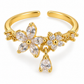 Anillo dorado de flores con detalle colgante