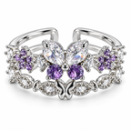 Anillo plateado de mariposa violeta y flores