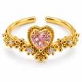 Anillo dorado de corazón rosa con borde de cuentas