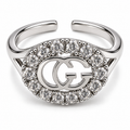 Anillo ajustable plateado con contorno circular de circonitas y centro calado