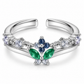 Anillo plateado de flor azul y hojas verdes