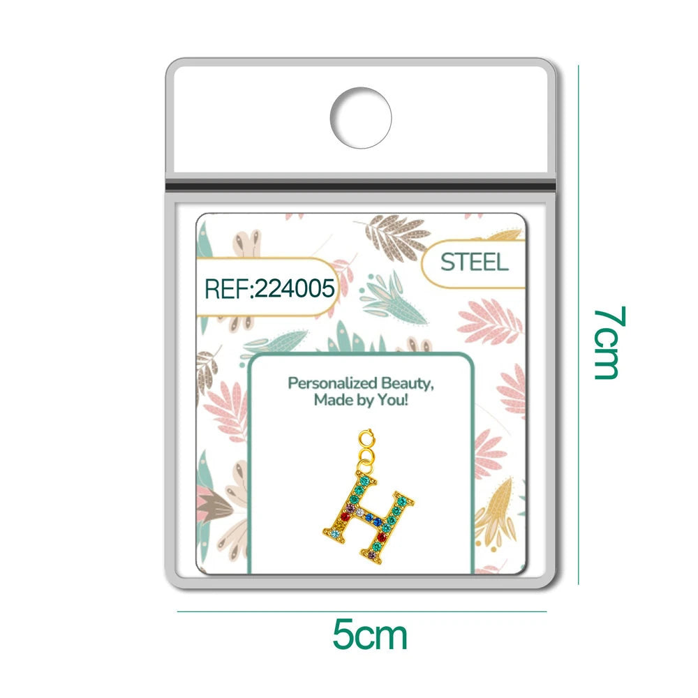 Charm Acero Dorado con Circonita Letra H Multicolor con Cierre detalle