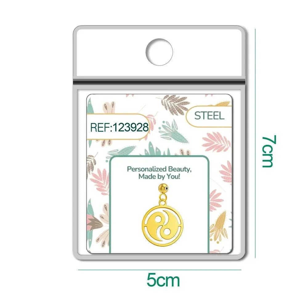 Charm dorado Triskel con bola de acero con goma en blíster