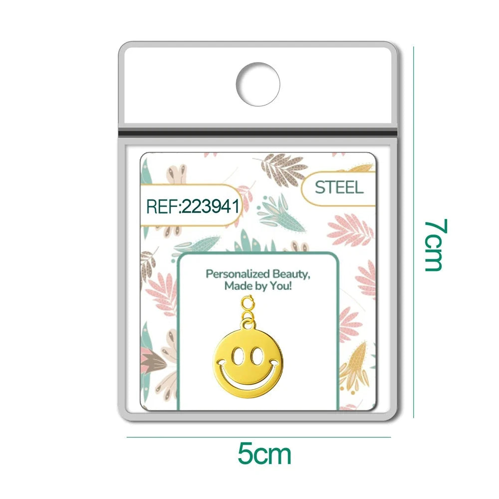 Charm Acero Dorado con Cierre Cara Sonriente detalle