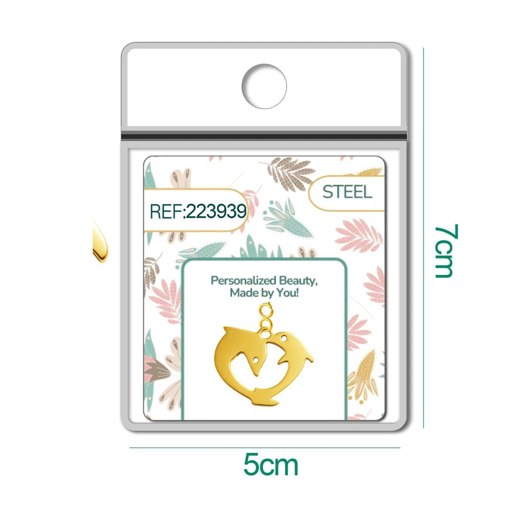 Charm Acero Dorado con Cierre Delfines detalle