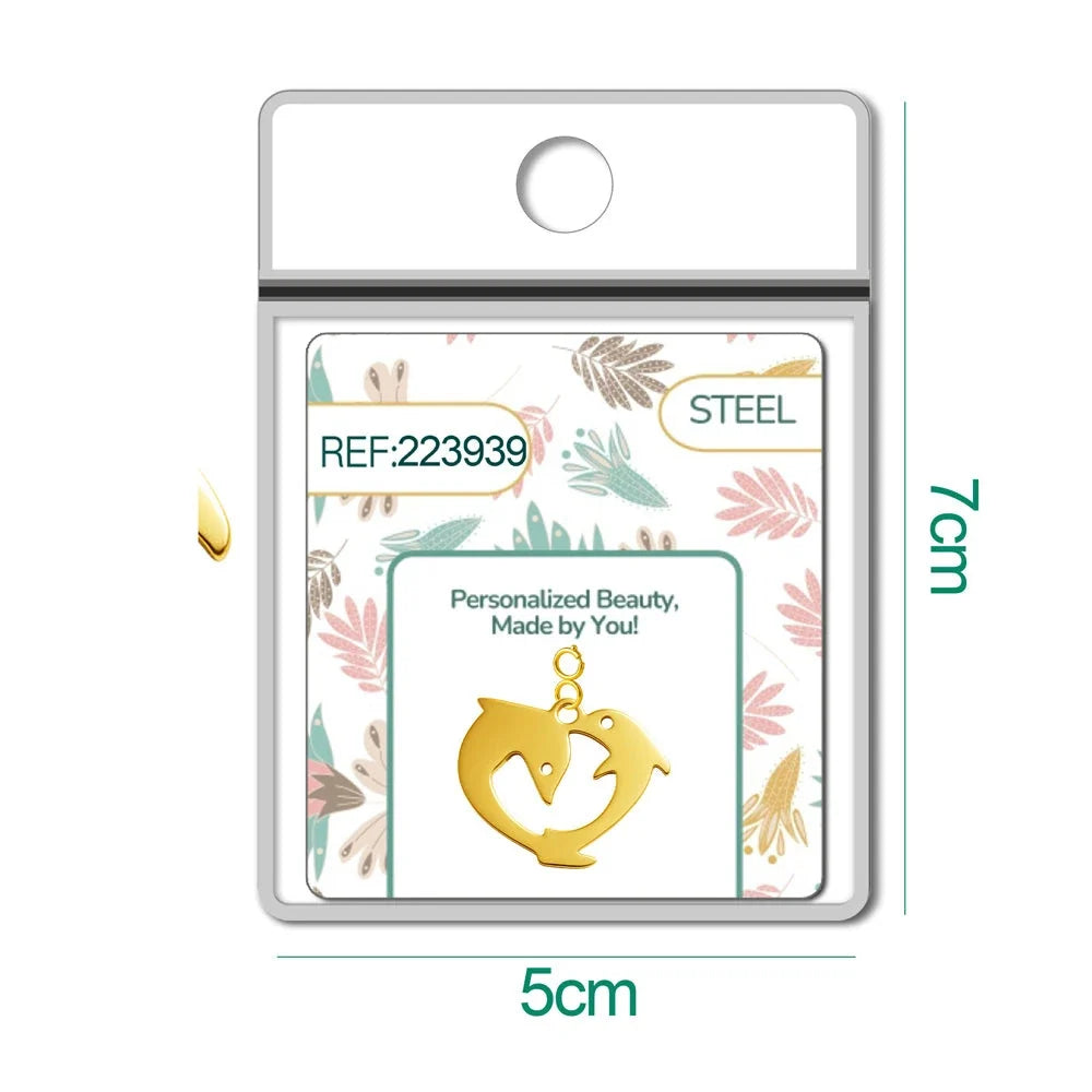 Charm Acero Dorado con Cierre Delfines detalle