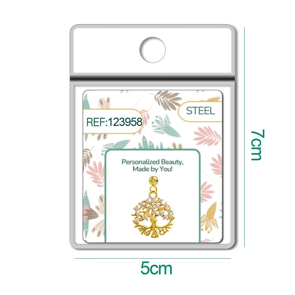 Charm de árbol de la vida dorado con raíces y circonitas con bola de acero con goma en blíster