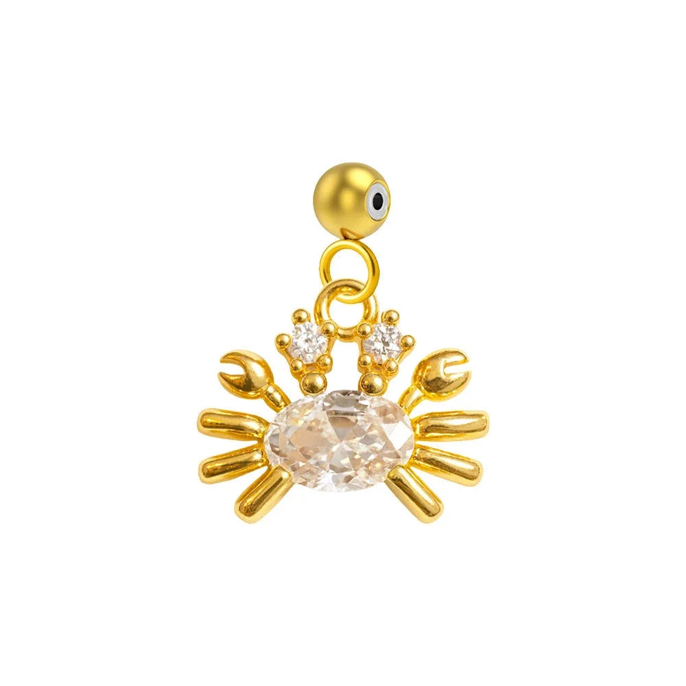 Charm colgante dorado de cangrejo con circonita ovalada y bola de acero con goma