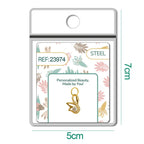 Charm de cisne dorado con circonita central y aro de acero, detalle
