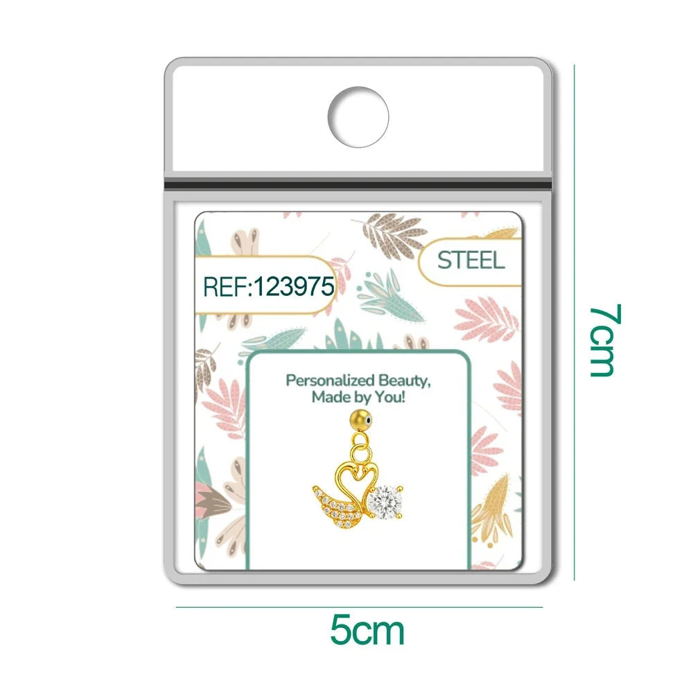 Charm de cisnes dorados con corazón y circonita, detalle con bola de acero con goma