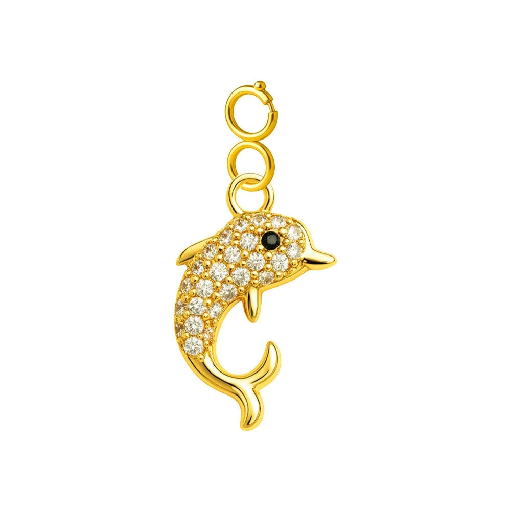 Charm colgante dorado de delfín con circonitas y ojo negro con cierre de acero