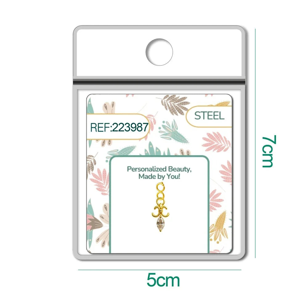 Charm dorado de flor de lis con circonita de lágrima con cierre de acero, en blíster