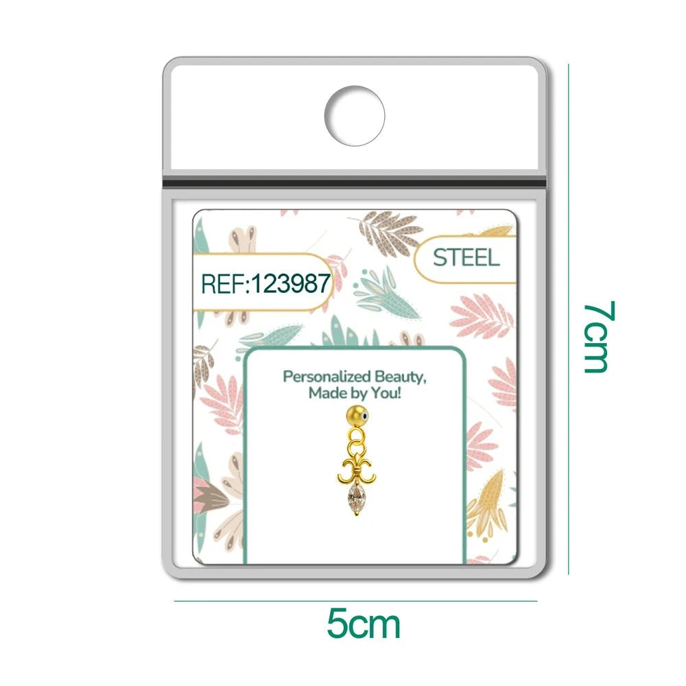 Charm dorado de flor de lis con circonita de lágrima con bola de acero con goma, en blíster