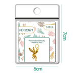 Charm de hada dorado con circonitas en blíster, vista frontal