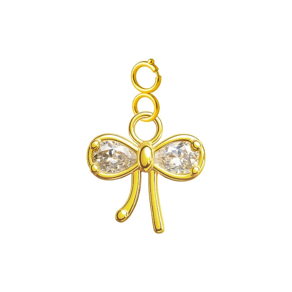 Charm colgante dorado de lazo con circonitas y cierre de acero