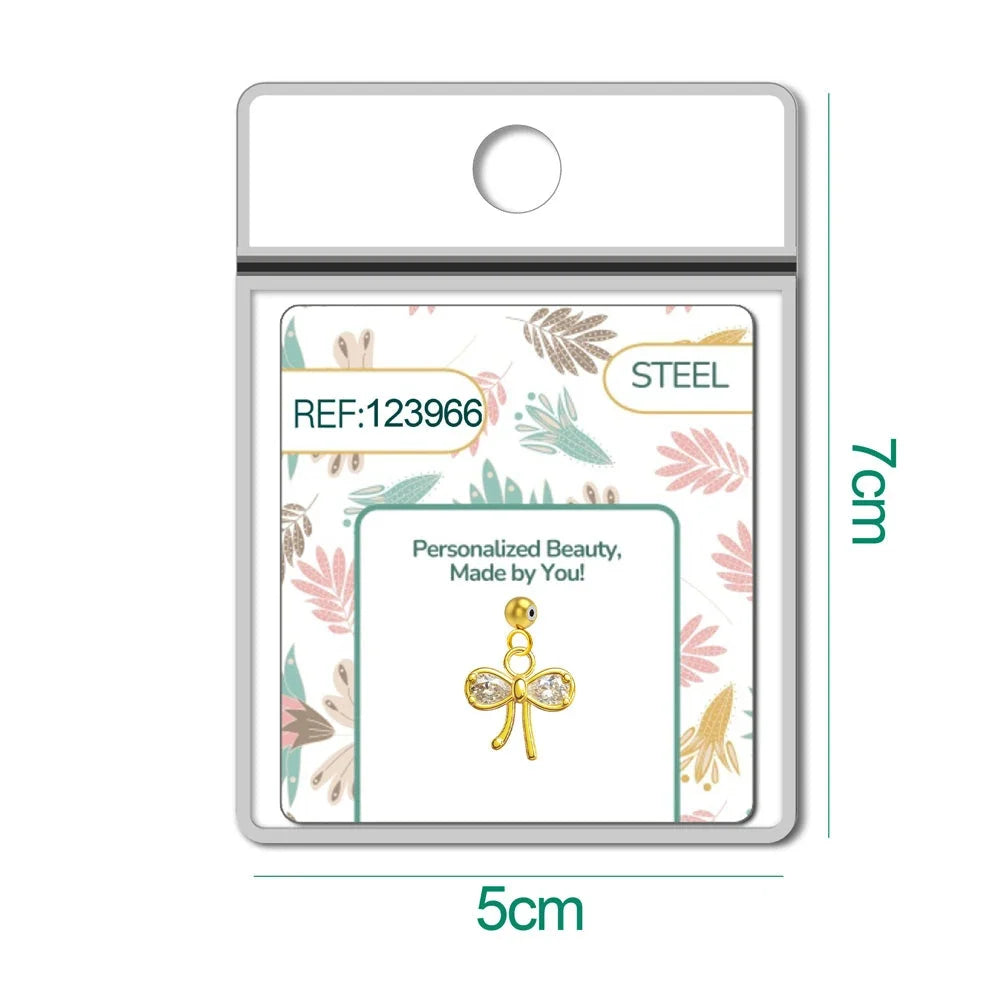Charm de lazo dorado con circonitas y bola de acero con goma en blíster