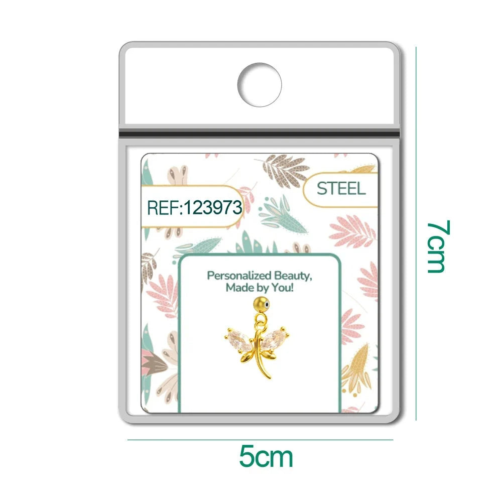 Charm de libélula dorado con circonitas y bola de acero con goma, detalle