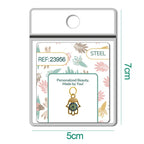 Charm de Mano de Fátima azul con circonitas en blíster, vista frontal
