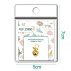 Charm dorado de manzana con circonitas con aro de acero, en blíster