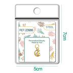Charm dorado de luna con dos conejos y circonitas con aro de acero, en blíster
