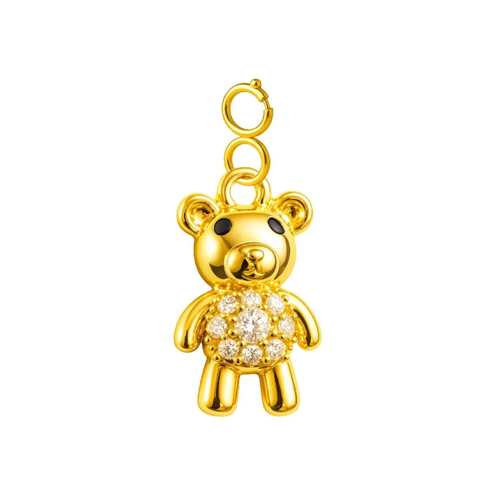 Charm colgante dorado de osito con circonitas y cierre de acero