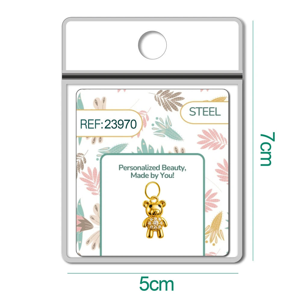 Charm de osito dorado con circonitas en blíster, vista frontal