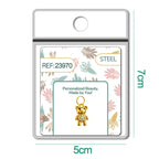 Charm de osito dorado con circonitas en blíster, vista frontal