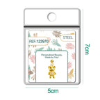 Charm de osito dorado con circonitas y bola de acero con goma en blíster