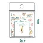 Charm de piña dorado con piedra transparente en blíster, vista frontal