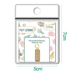 Charm rectangular dorado pavé con circonitas y aro de acero, detalle