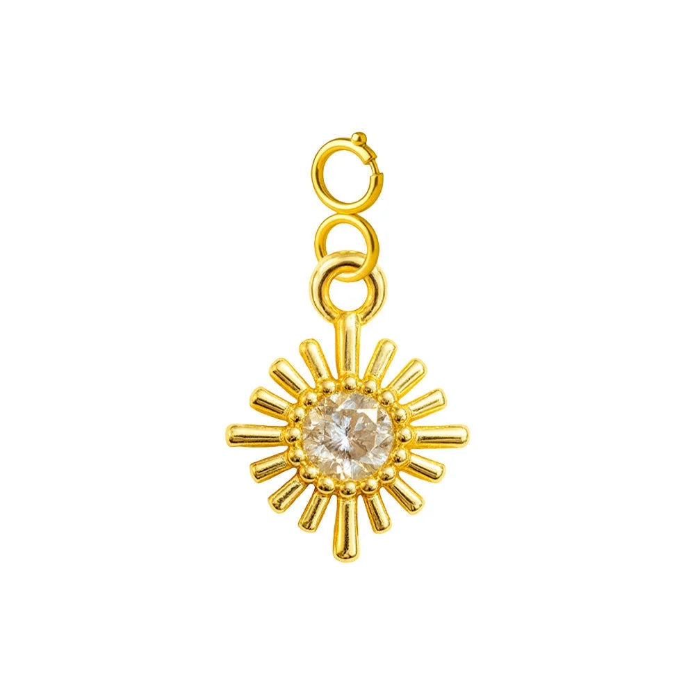 Charm colgante de sol radiante dorado con circonita central y cierre de acero