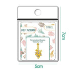 Charm dorado de racimo de uvas con circonitas lila con bola de acero con goma, en blíster